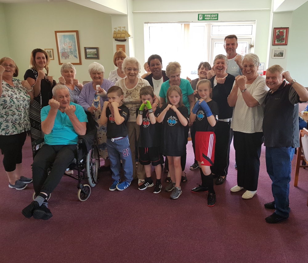Strelley kids pack a punch teaching NCH tenants boxing moves