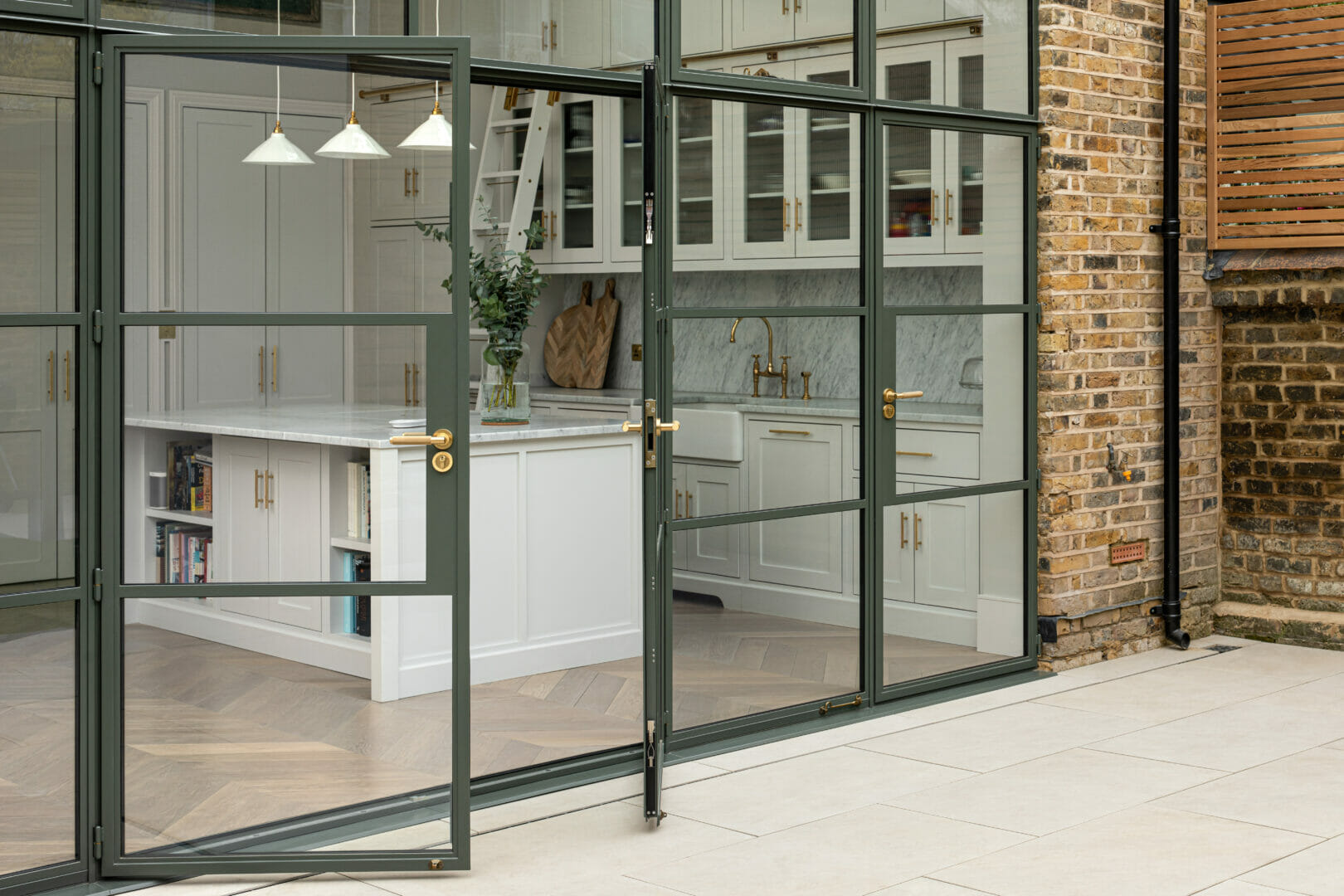 W20 door screen streams light into Wandsworth kitchen extension